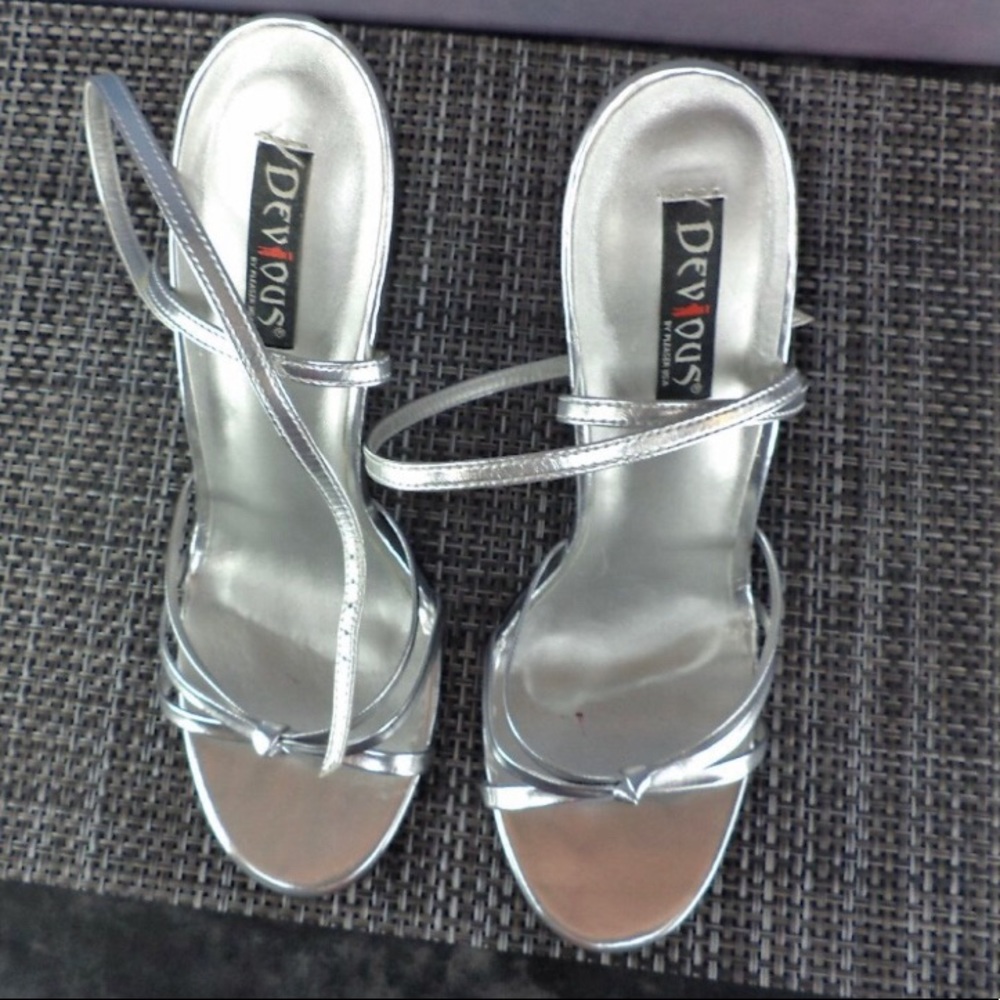 Silver stiletto strappy 4" heels w/ wrap around ankle strap.